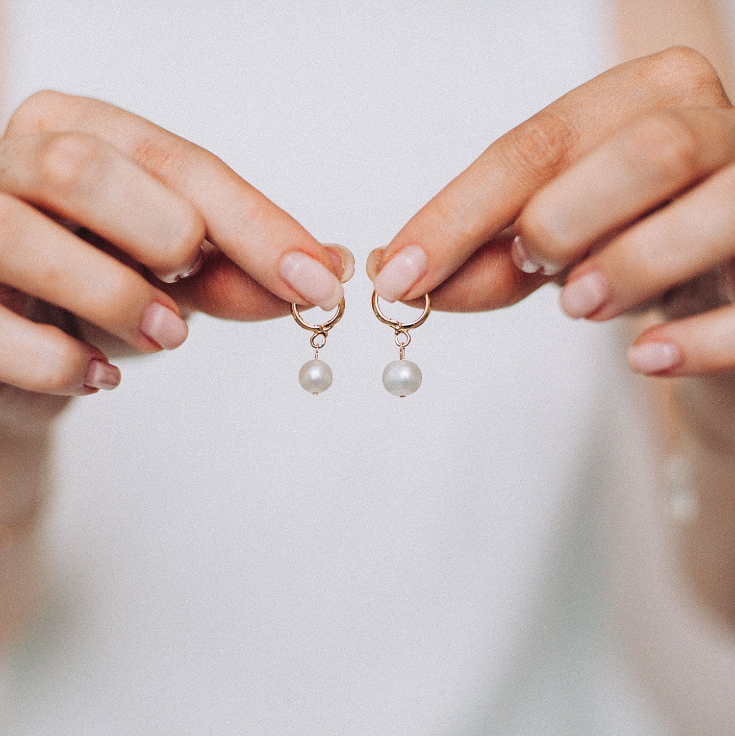 Celine Pearl Huggie Earrings